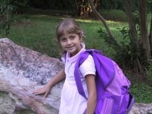 Girl Smiling with Purple Backpack